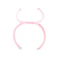 DIY pink braided cord bracelet detail, featuring adjustable knot and steel rings for charms. - Pink