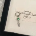 Detailed shot of trendy green crystal spike hoop earring, silver tone metal craft accessory. - 3534 Green Rhinestone (Single Piece)