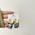 Chic geometric earrings featuring brushed gold and black white pattern for women daily wear. - Zebra Print