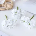 White artificial silk flower bunches for DIY craft, wedding wreaths, and scrapbooking decor. - White