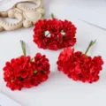 Red artificial silk flower bunches for DIY crafts, wreaths, and wedding decorations. - Red