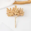Gold artificial pine branches for Christmas tree decoration, wreath and floral arrangement accessories. - Gold