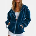 Detailed close-up view of the women's stylish dark blue velvet zip-up hooded sweatshirt. - S / Teal