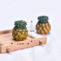 Miniature pineapple model detail close-up, small resin simulation fruit decor toy display. - Pineapple