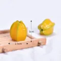 Miniature artificial starfruit model detail close up view, realistic resin fruit craft decoration for dollhouse desktop. - Star Fruit Charm
