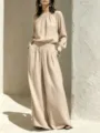 Detailed shot of the casual cotton linen outfit set featuring a wide top and trousers. - S / Apricot