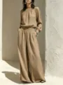 Detailed shot of women casual linen outfit set loose long sleeve top wide leg pants chic style - Khaki