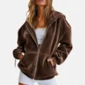 Detailed view of brown velvet zip hoodie featuring soft texture, metal zipper and hood. - S / Dark Brown