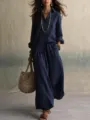 Detail view of the navy blue linen shirt and wide leg pants set, showcasing lightweight fabric. - Navy Blue