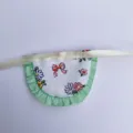 Miniature doll apron floral pattern with green ruffles and white ribbon for DIY crafts plush toys - Red Garden Bib