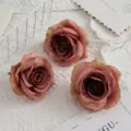 Detailed close-up view of vintage pink artificial rose flower heads for photography and decor. - Dark Coffee
