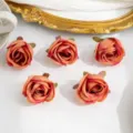 Têtes de roses artificielles en tissu de soie, couleur pêche pour corsages et chapeaux. - Rouge brunâtre clair