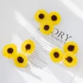 Closeup of artificial yellow sunflower heads, silk flower DIY accessories for crafts. - Yellow