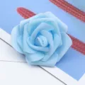 Detail view of light blue PE foam artificial rose flower head for DIY wedding bouquets and decor. - Blue
