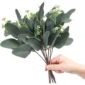 Detailed close-up view of artificial eucalyptus leaves bouquet, perfect for floral arrangements. - Apple Leaves + Berries - Pointed Tip