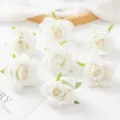 White artificial rose flower heads, perfect for DIY garlands, crafts, and wall background. - White