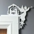 Christmas Nativity door corner decoration wooden detail view showing angel and holy family. - Angel White