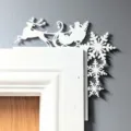 Christmas door corner decoration detail view, white wooden Santa reindeer snowflake festive prop. - Santa Claus White