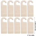 Detailed view of 10 unfinished wooden door hanger blanks, measuring 8.85x3.15 inches for DIY crafts. - Style 5