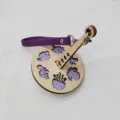 Portable wooden wrist yarn holder with purple leather strap and cute marine animal designs. - Purple Leather Strap