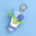 Handmade crochet tulip bouquet keychain featuring blue flowers and a silver spring clasp - Gradient Blue (Round Clasp)