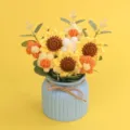 Handmade crochet sunflower bouquet in a blue vase on a yellow background gift detail - 3 Pointed Sunflowers / Flower Series-3 Pointed Sunflowers (Blue Pot)