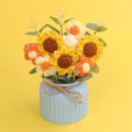 Handmade crochet sunflower and puff flower bouquet in a light blue ribbed vase detail view - Flower Series-3 Little Sun Sunflowers (Blue Pot)