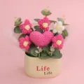 Detail view of a hand-knitted heart and puff flower crochet potted plant on pink background. - Single Heart Flower Tube (Life Pot) / Rose Red