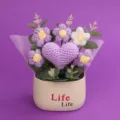 Close-up of handmade crochet purple heart and puff flowers in a beige Life pot - Single Heart Flower Tube (Life Pot) / Purple