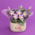 Hand-crocheted puff flower potted plant with five purple flowers in a white decorative pot - Puff Flower Potted Plant / Purple