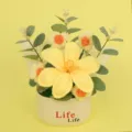 Detailed macro view of handmade crochet yellow flower bouquet in white Life pot - Yellow