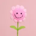 Handmade pink crochet flower bouquet detail featuring a charming smiley face design - Pink 5 Rings Smiley Face With 2 Leaves