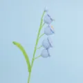Close-up of handmade crochet lily of the valley with light blue bell flowers - Four-Head Lily of the Valley Branch (Finished) / Blue