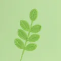 Primo piano di uno stelo di foglia all'uncinetto verde fatto a mano con trama - Ramo di Foglie a 7 Foglie per Tutte le Stagioni / Verde Germoglio