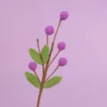Detailed view of handmade crochet flower branch with purple berries and green leaves - Purple