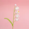 Detailed view of the intricate handmade crochet texture of a white lily of the valley - Four-Head Lily of the Valley Branch (Finished) / White