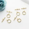 Gros plan sur des fermoirs à bascule OT dorés pour la création de bijoux DIY - 12mm / Or 18 carats