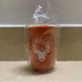 Orange press-type beer bottle opener with white deer head graphic for home bar and kitchen use. - PP Orange Deer Head