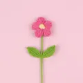 Detailed view of a handmade pink crochet puff flower with intricate knit texture. - Large Puff Flower (Double Leaf) / Rose Red