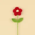 Close-up detail of a handmade red crochet puff flower showing texture and craftsmanship - Large Puff Flower (Double Leaf) / Red