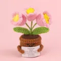 Close-up of a handmade crochet tulip pot featuring an English motivational support card - 3-Headed Lily Of The Valley / Pink