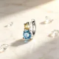 Close-up of titanium steel earring with stacked light blue and yellow stones - Yellow And Blue (Single Ear Clip With Steel Needle)