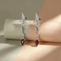 Dark gothic angel wing drop earrings with a stunning red rhomboid crystal accent stone - Left Wing - Stainless Steel Rod (A1465-3)