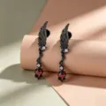 Gothic black angel wing stud earrings with vibrant red rhombus gems and titanium posts - Right Wing - Stainless Steel Rod (A1465-2)