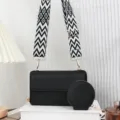 Borsa a tracolla in pelle nera con ampia tracolla a motivi bianchi e neri - Nero
