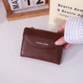 Minimalist dark brown leather card holder for women featuring CLASSIC & QBH text - Coffee