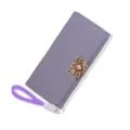Elegant lavender long trifold wallet for women featuring gold clasp and wrist strap - Purple