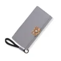 Elegant grey women's long trifold wallet featuring gold buckle and wrist strap detail. - Tri-fold Long Style (QBH-96-35) / Gray