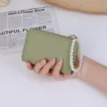 Minimalist green lychee texture wallet with elegant pearl wrist strap - Green