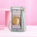 Close-up of mint green crossbody phone bag with transparent touchscreen window - Green